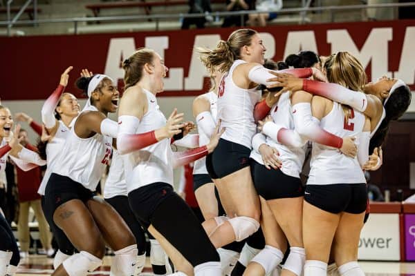 Alabama volleyball players celebrate their win over Texas A&M.