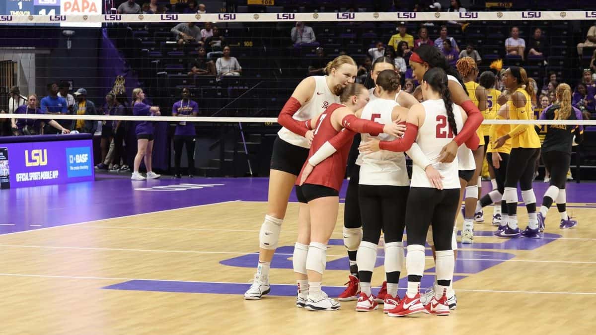 Alabama volleyball players huddle up in between sets.