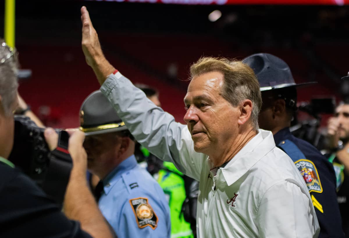 Alabama head football coach Nick Saban walks off the field and waves to fans after the Crimson Tide’s win against Georgia at the SEC Championship game on Dec. 2 in Atlanta, GA.