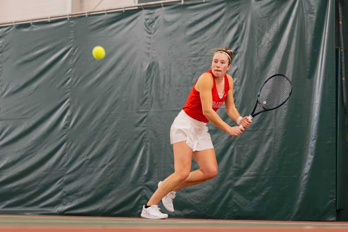 Alabama womens tennis player Margaux Maquet gets ready to swing at the ball.