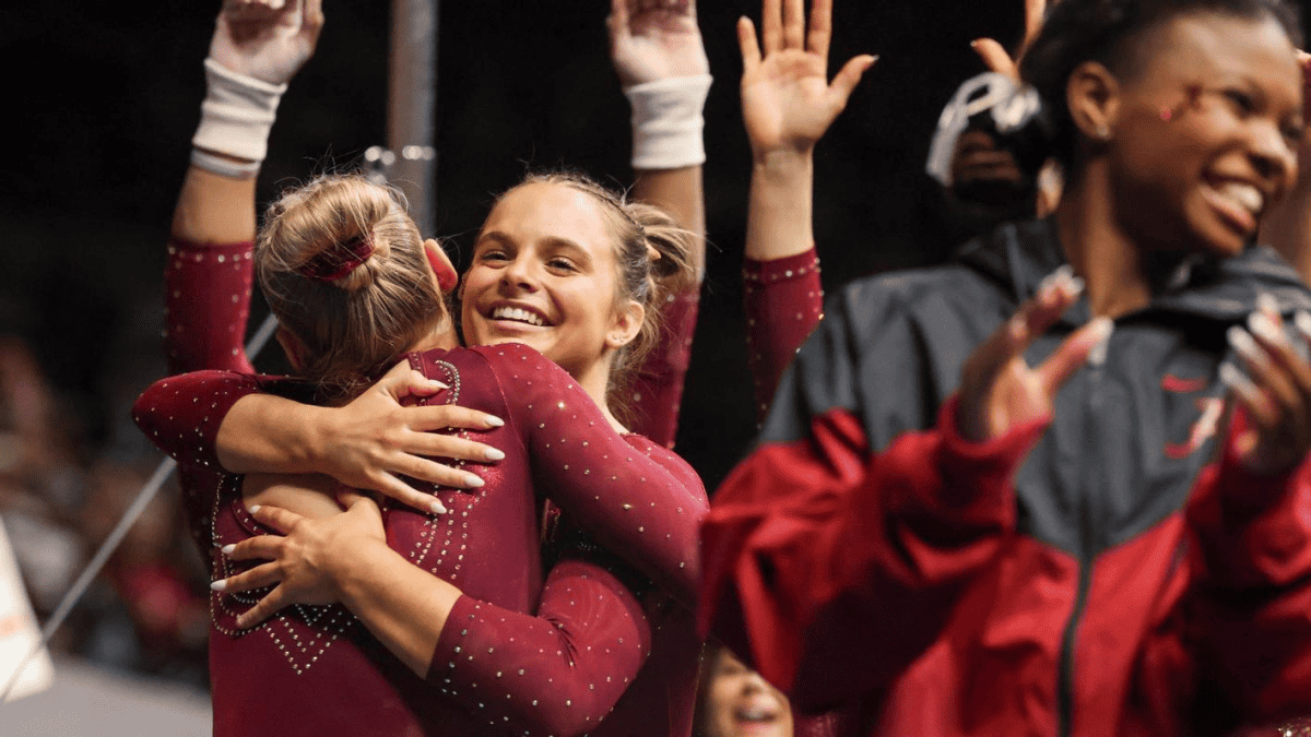 Alabama gymnast Lily Hudson celebrates her routine with teammates against Kentucky on Jan. 26 in Gainesville, FL.