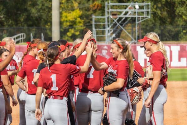 Alabama softball players huddle up during the game against Chipola College.
