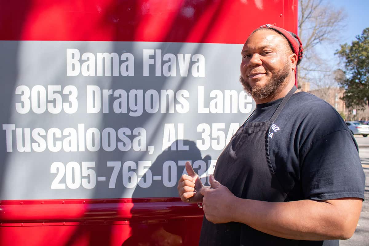 Frederick Fitch, the owner of Bama Flava, standing by his food truck.
