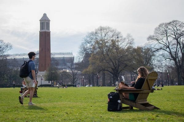 Students enjoy a sunny afternoon on the Quad.
