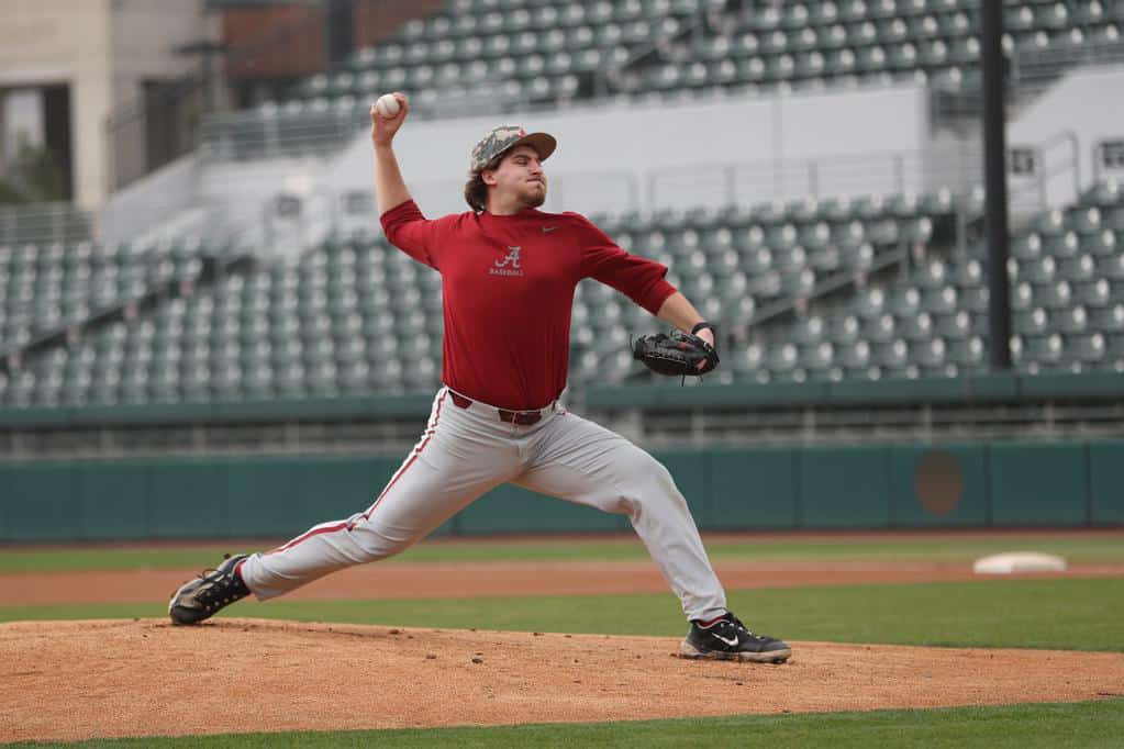 Alabama Baseball Player Ben Hess (27) pitches the ball during practice at Sewell-Thomas Stadium in Tuscaloosa, AL on Friday, Jan 26, 2024.