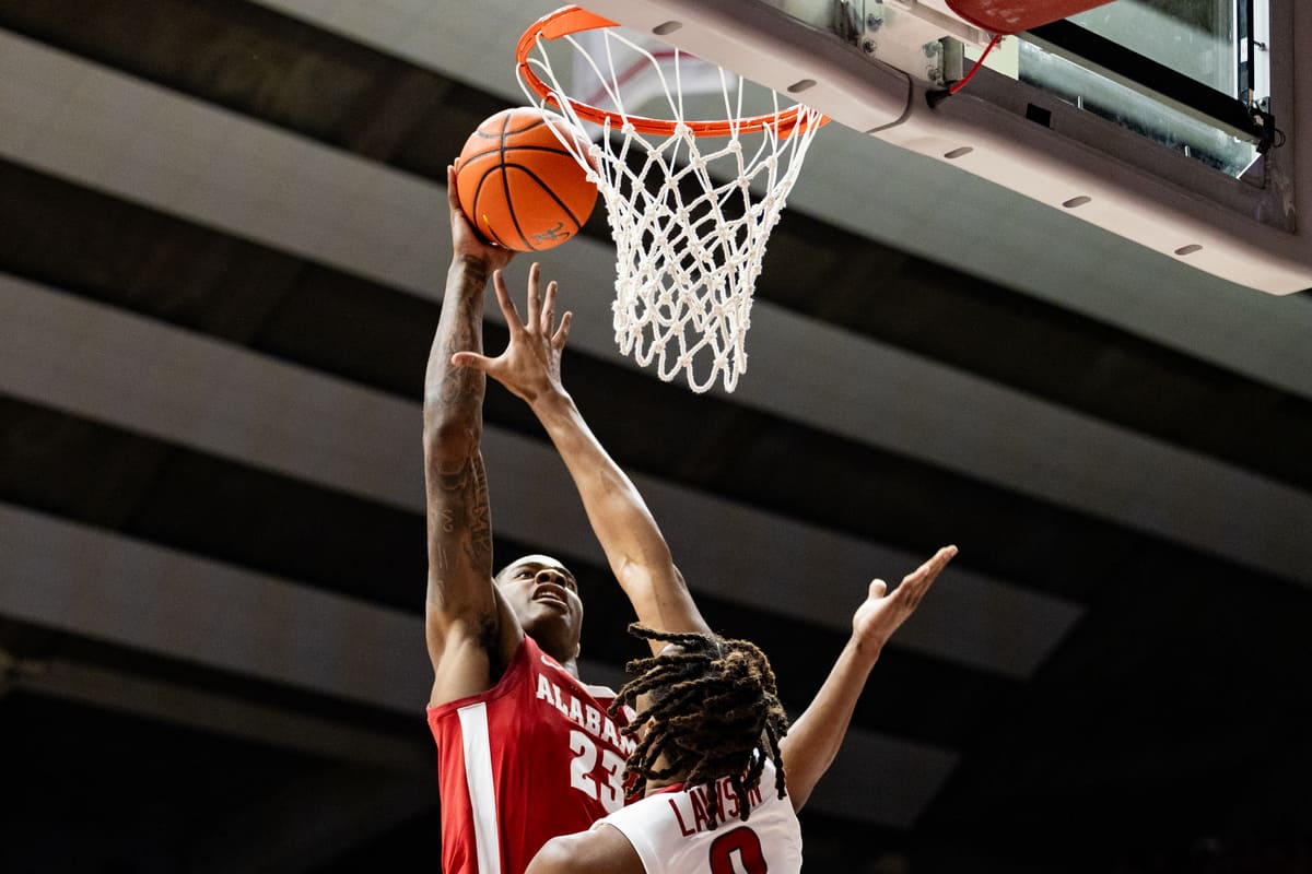Alabama forward Nick Pringle jumps to score against Arkansas on March 9 in Coleman Coliseum.