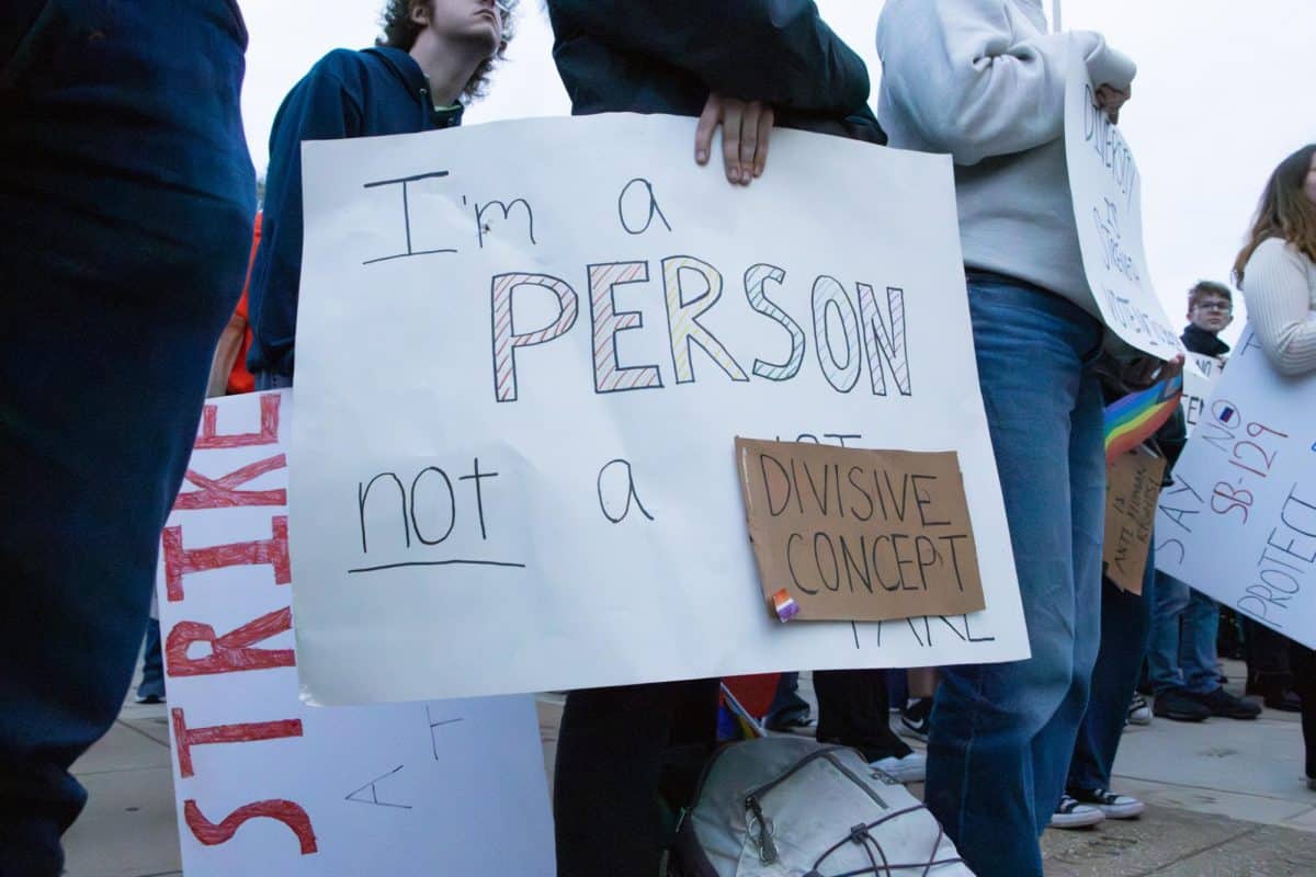 A student protests SB 129 during a demonstration at the University of Alabama.