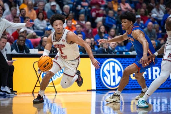 Alabama guard Mark Sears (#1) dribbles down the court against Florida.