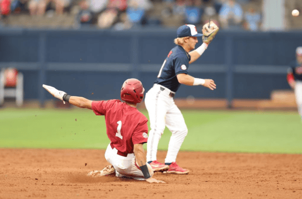 Alabama baseball player Justin Lebron (1) slides into base against Ole Miss at Swayze Field in Oxford, MS on Thursday, Apr 25, 2024.