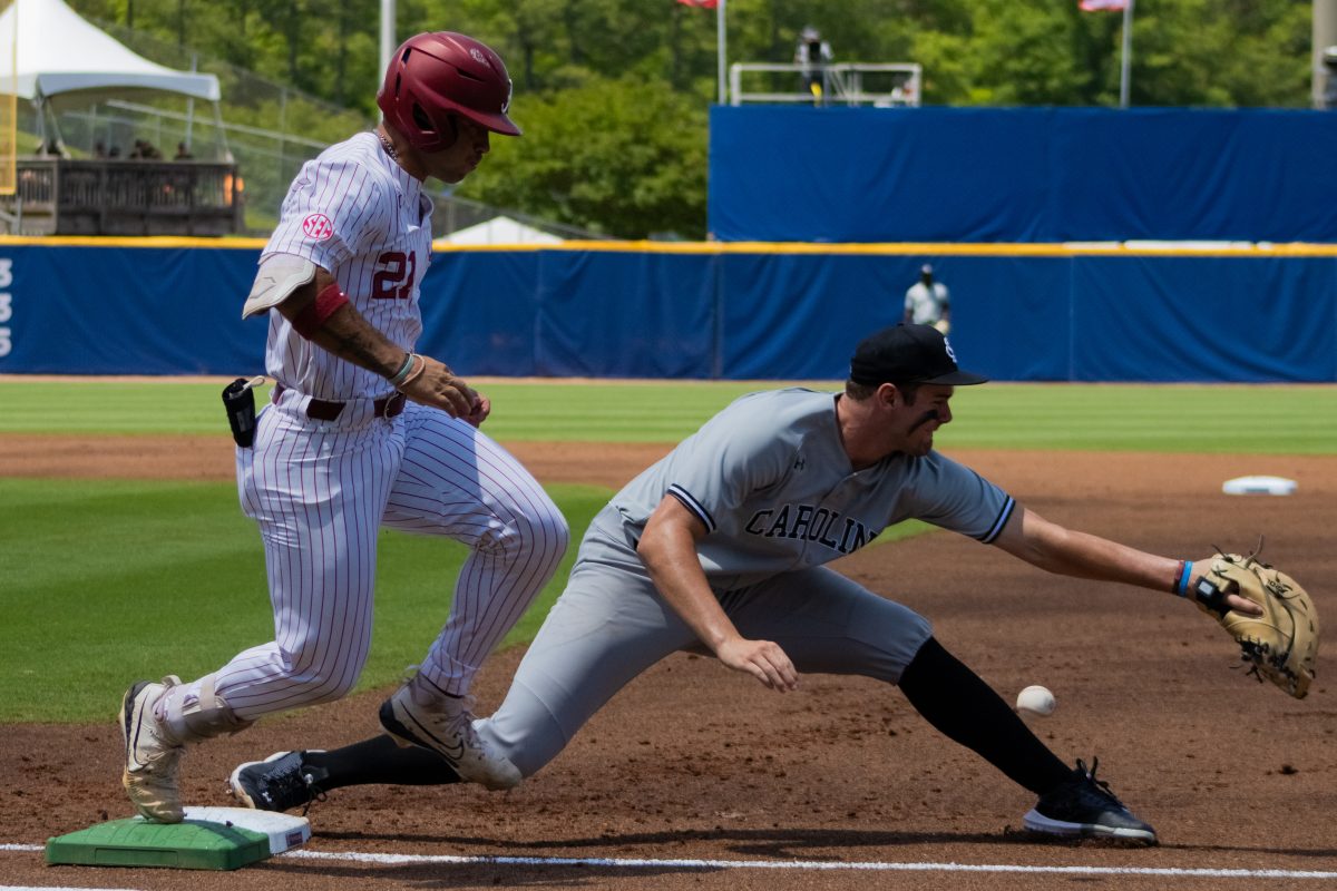 Alabama baseball player Ian Petrutz runs through first base against South Carolina during the SEC Baseball Tournament in Hoover, Ala.