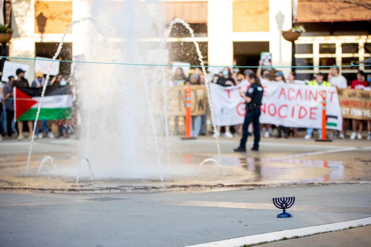 A menorah sits on the side of the counterprotesters at the UA pro-Palestine protest on May 1.