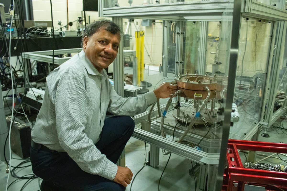Ajay Agrawal, a professor of mechanical engineering at The University of Alabama, presents a rotating combustion engine prototype in his lab.