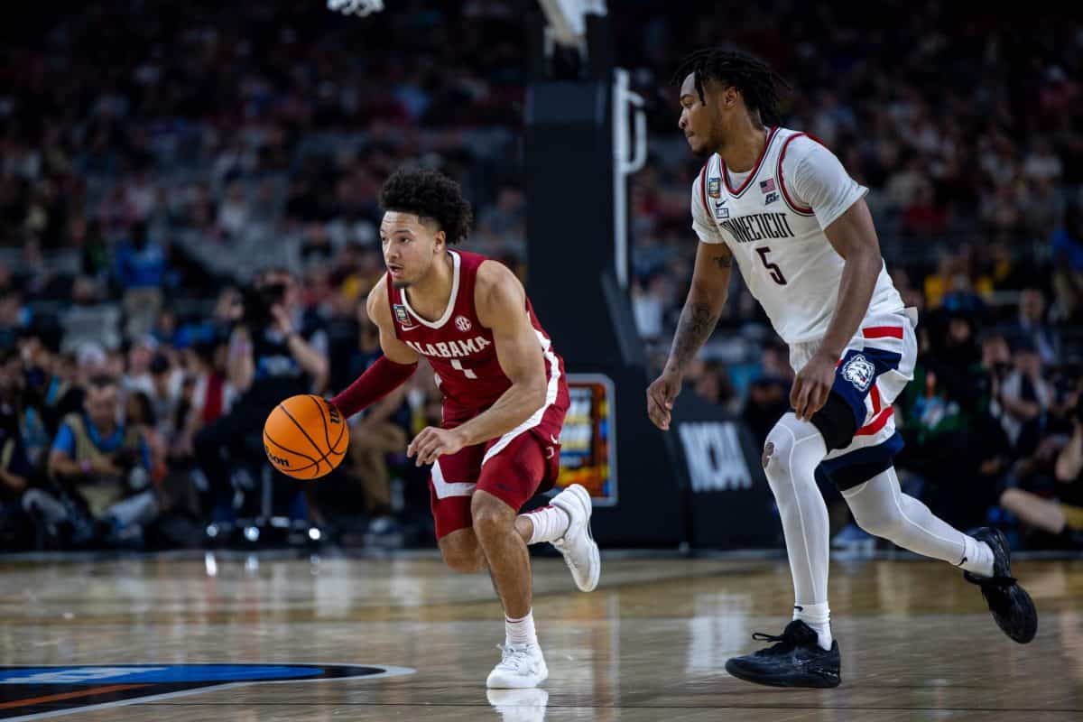 Alabama+guard+Mark+Sears+%28%231%29+dribbles+down+the+court+against+UConn+during+the+Mens+Final+Four+at+State+Farm+Stadium+in+Glendale%2C+AZ+on+April+6%2C+2024.
