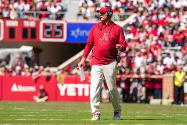 Alabama football head coach Kalen DeBoer watches A-Day from the field.