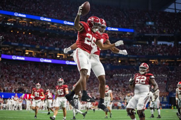 Alabama running back Jam Miller (#26) celebrates after scoring a touchdown during the SEC Championship game against Georgia.