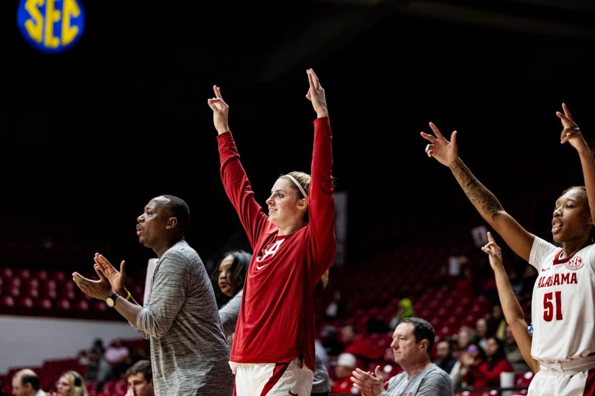 Alabama guard Sarah Ashlee Barker (#3) cheers on the sidelines.