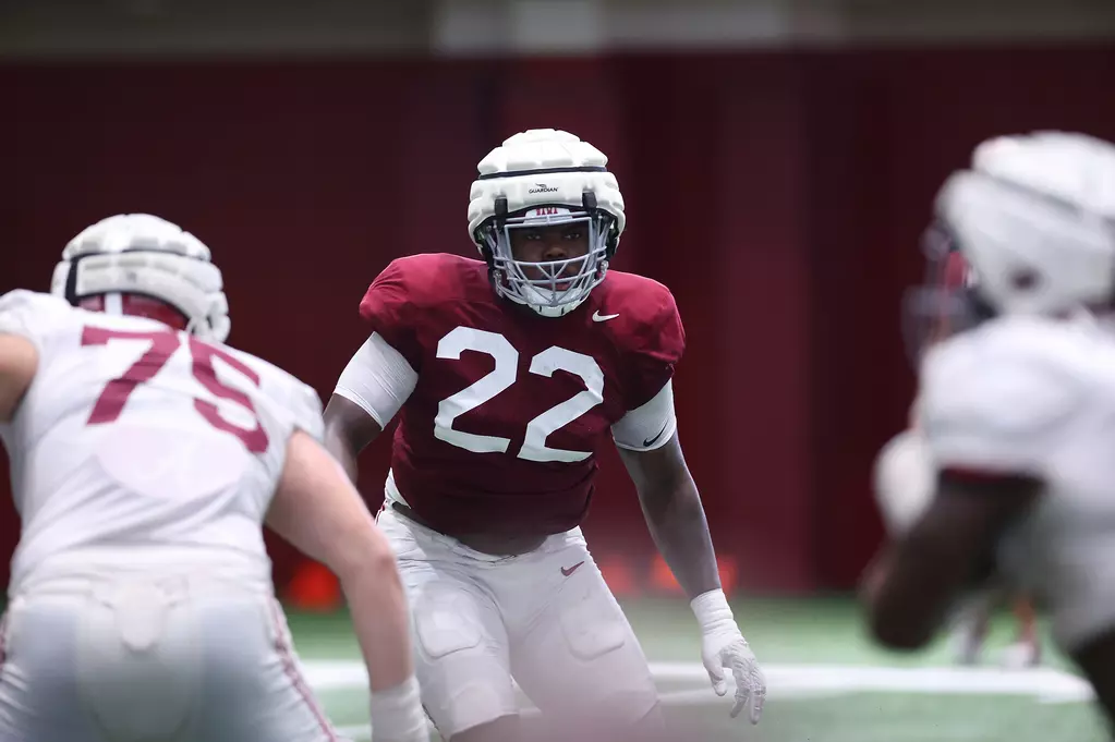 Alabama defensive lineman LT Overton (#22) sets up for a play during practice.
