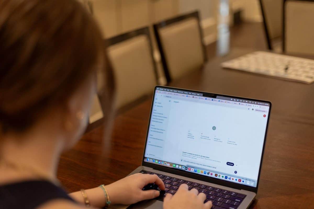 A student looks at ChatGPT on their computer.