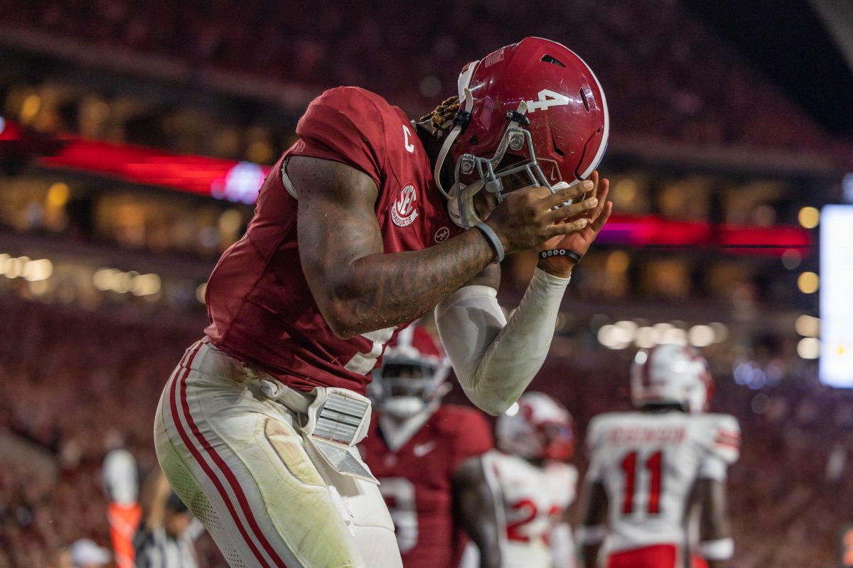 Alabama quarterback Jalen Milroe (#4) celebrates after scoring a touchdown against Western Kentucky.