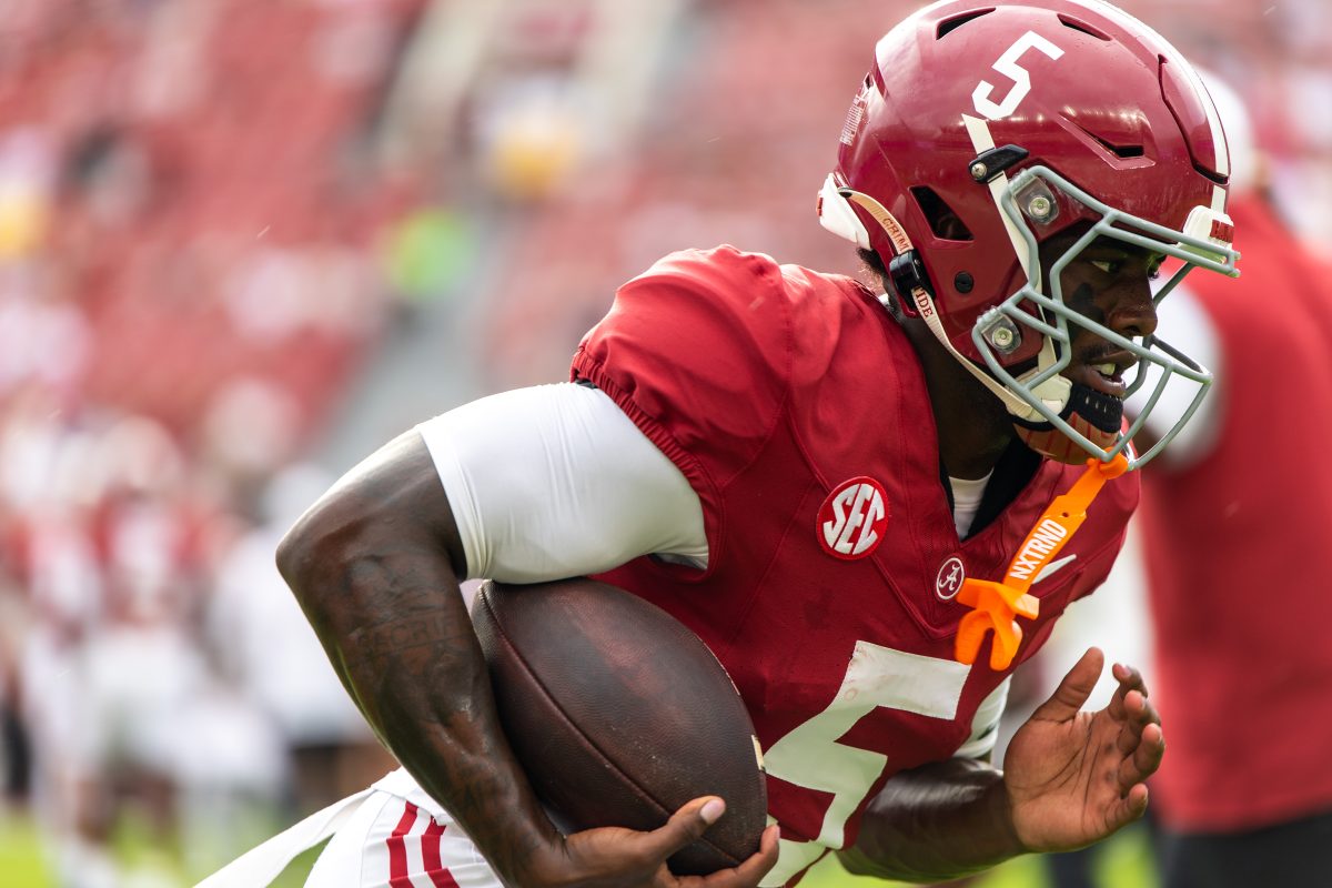 Alabama wide receiver Germie Bernard (#5) runs with the ball during warmups prior to the Western Kentucky game.