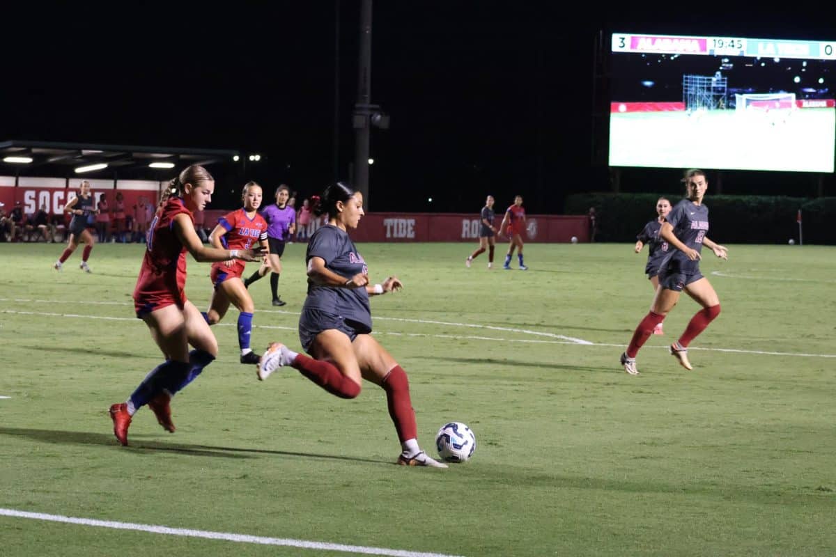 Alabama forward Nedya Sawan (#16) dribbles away from a Louisiana Tech defender.