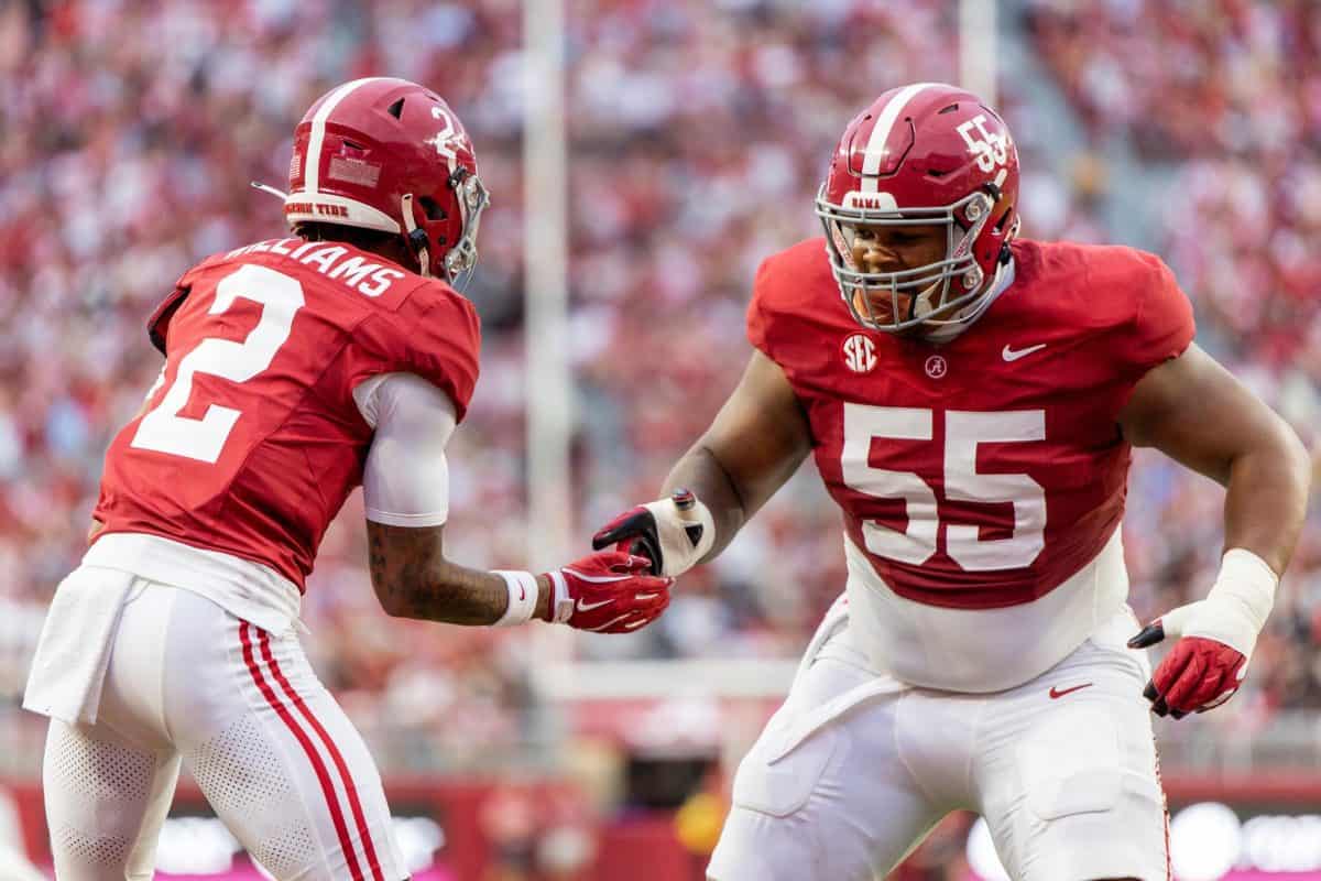 Alabama offensive lineman Roq Montgomery (#55) celebrates with wide receiver Ryan Williams (#2).