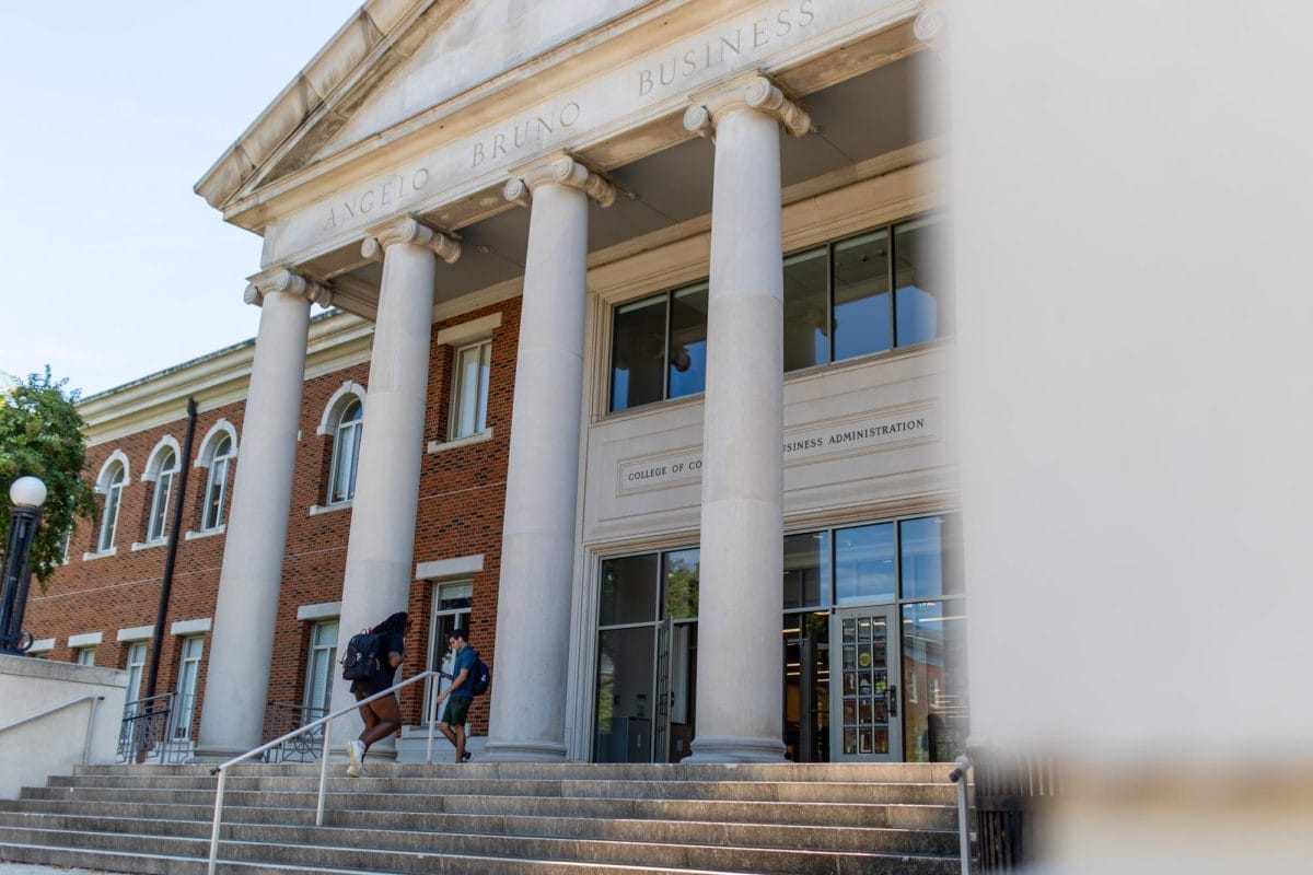 Students walking into the library.