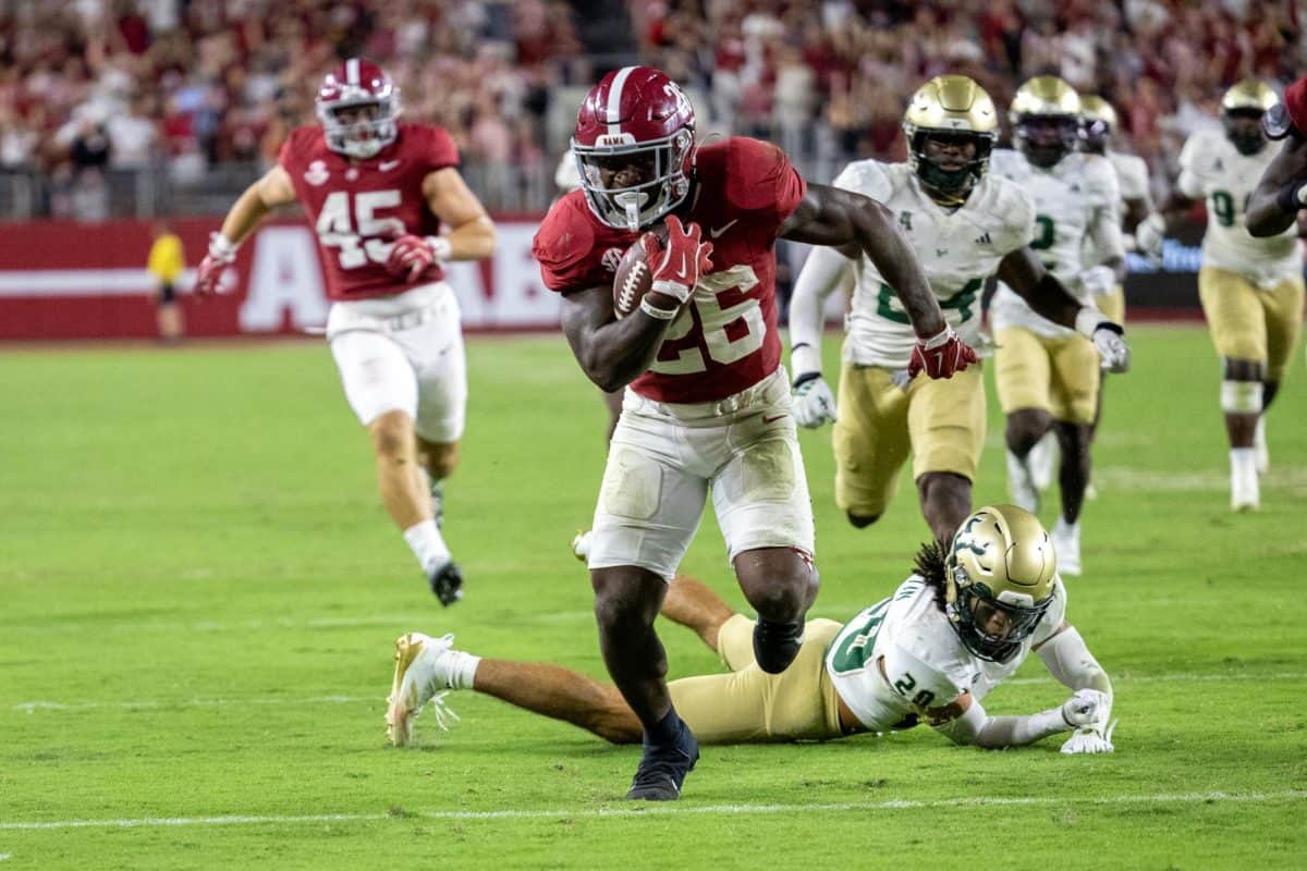 Alabama running back Jam Miller (#26) escapes from a South Florida defender.