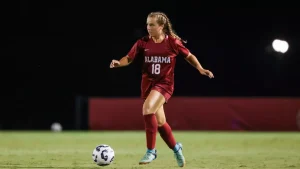 Alabama midfielder Madeline Padelski (#18) dribbles down the field.