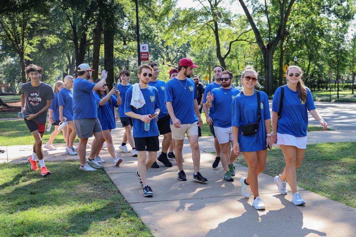 Students pass by the front of Denny Chimes during the Yellow Ribbon Run.