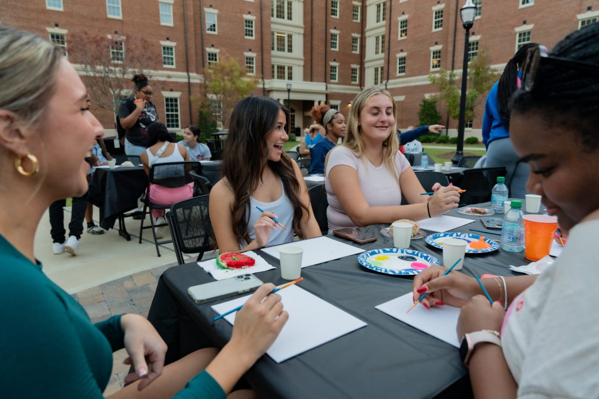 Students paint during Hispanic Heritage Month Paint Night.