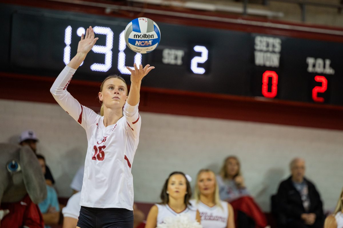 Alabama outside hitter Sophie Agee serves a ball.