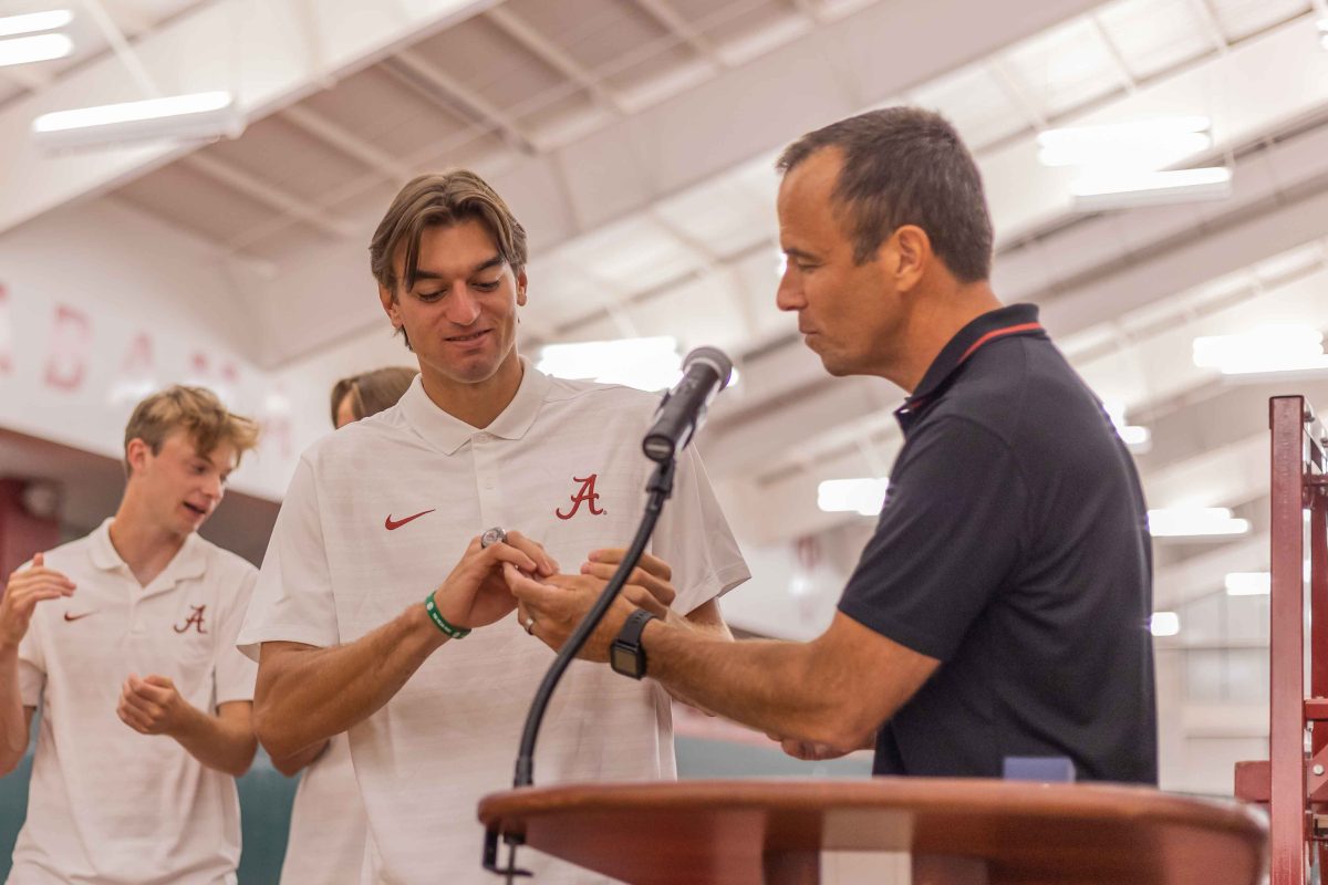 Alabama tennis player Flip Planinsek receives his ring after winning the 2024 NCAA singles championship.