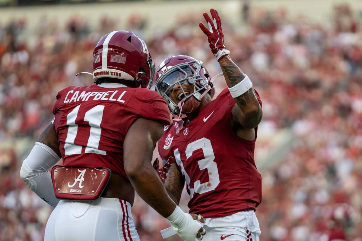 Alabama linebacker Jihaad Campbell (#11) and defensive back Malachi Moore (#13) celebrate after a play against South Flordia on Aug. 7, 2024.