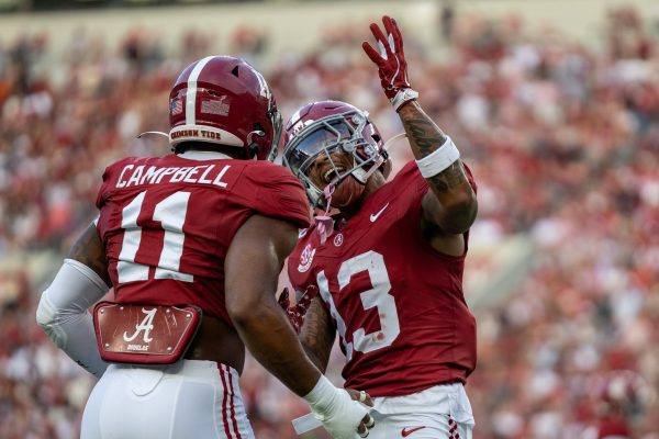 Alabama linebacker Jihaad Campbell (#11) and defensive back Malachi Moore (#13) celebrate after a play against South Flordia on Sept. 7, 2024.