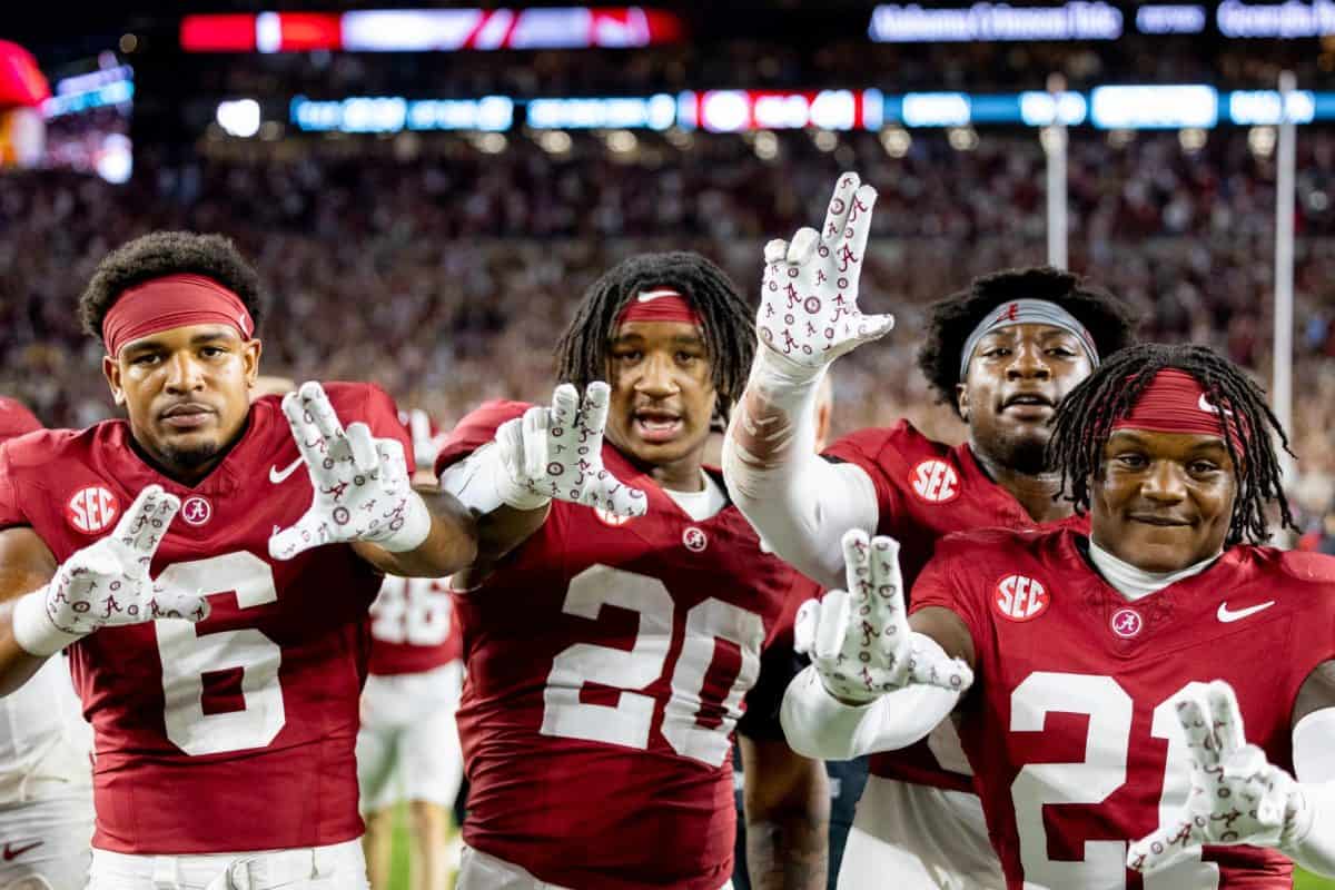 Alabama football players celebrate after defeating Georgia. 