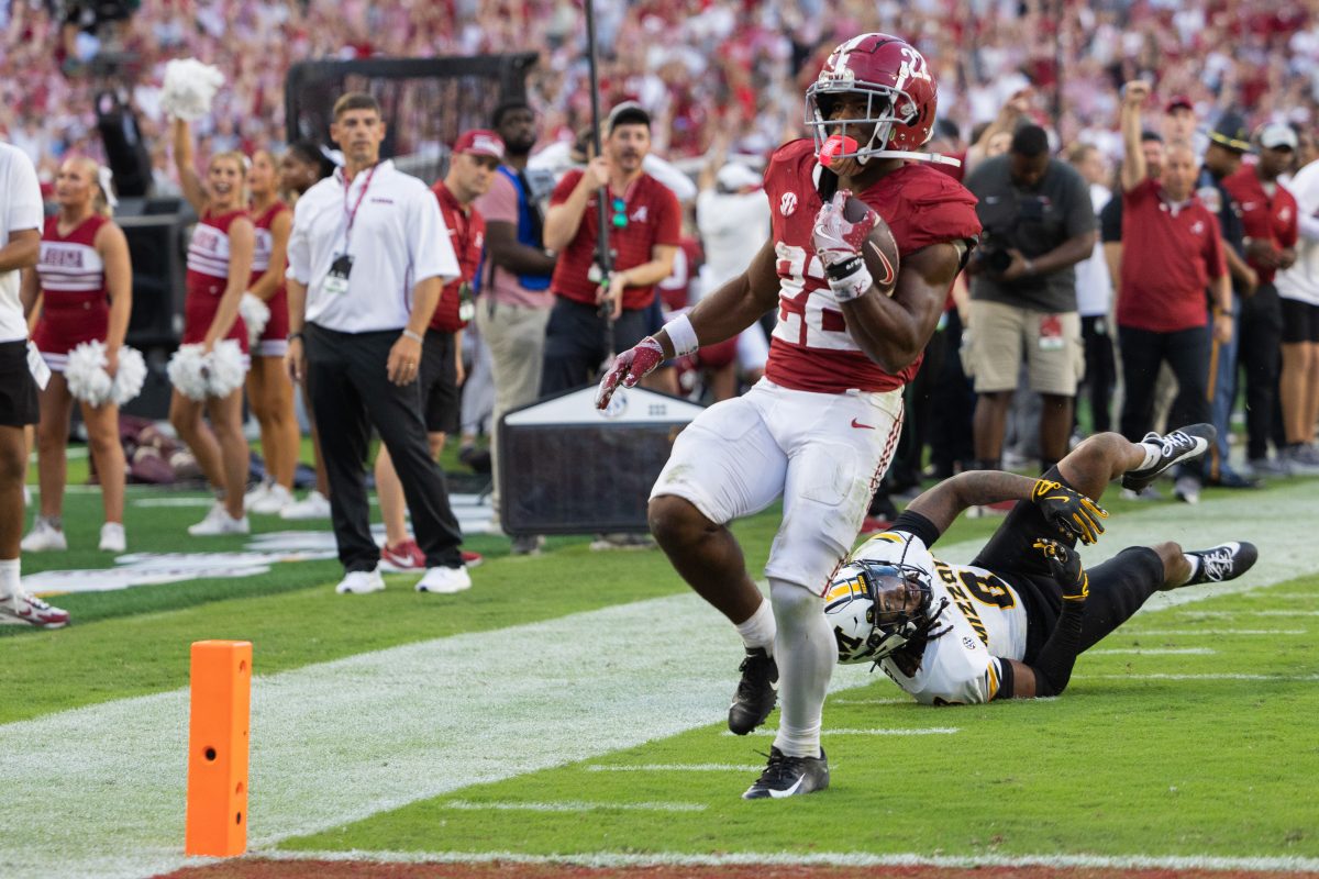 Alabama running back Justice Haynes (#22) runs into the end zone against Missouri.