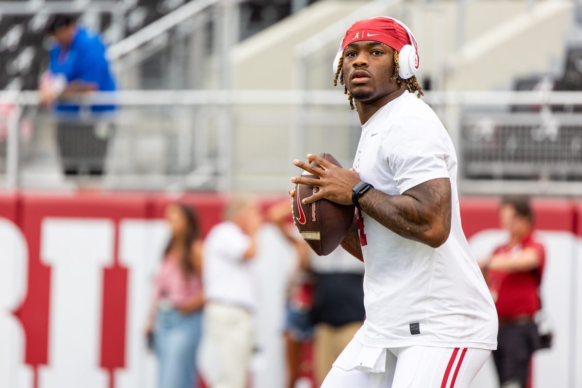 Alabama quarterback Jalen Milroe (#4) prepares to throw a pass during warmup.