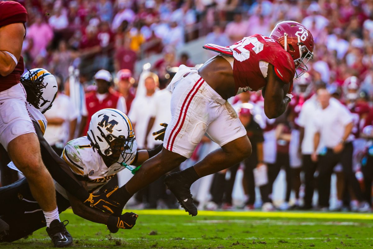 Alabama running back Jam Miller (#26) breaks through the Missouri defense to score a touchdown.