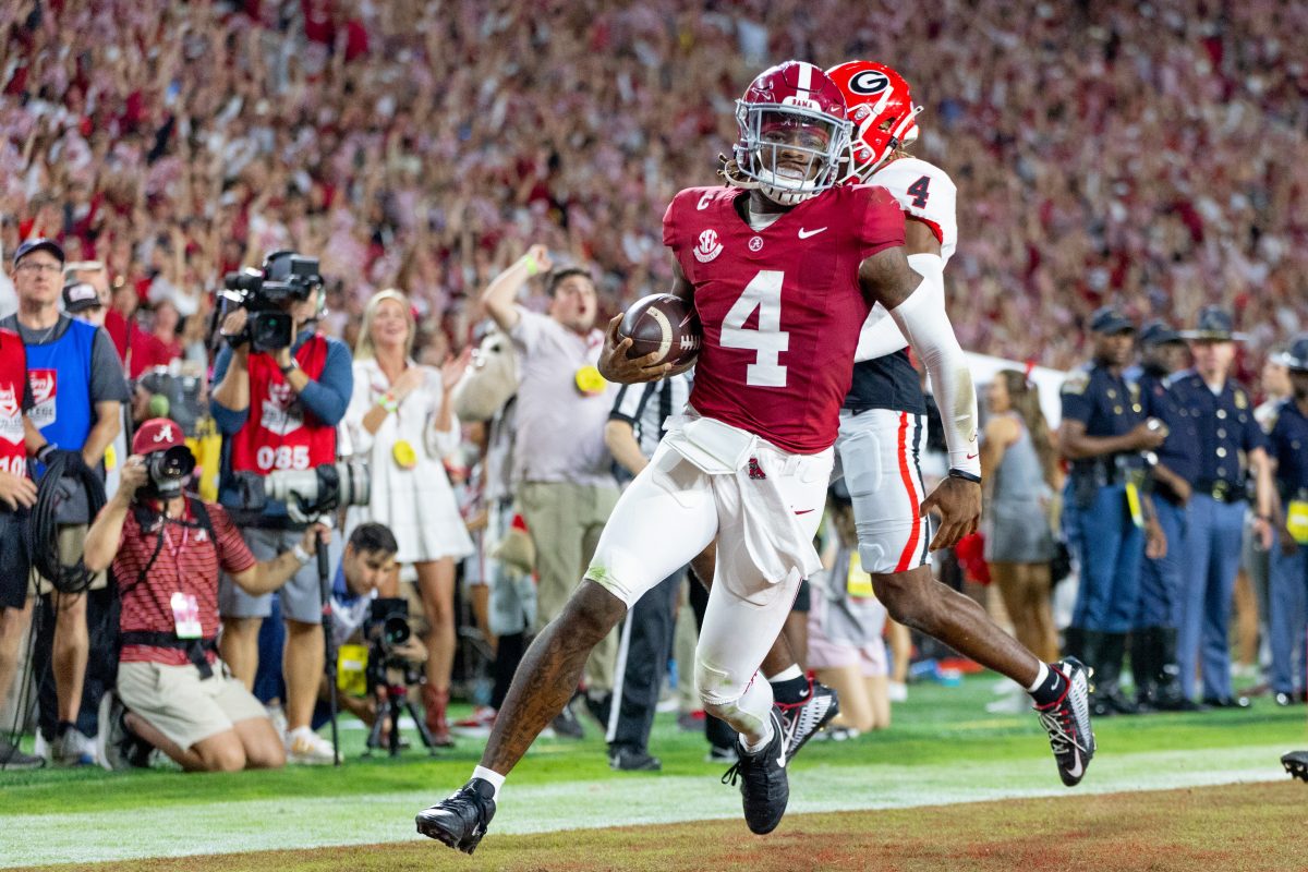 Quarterback Jalen Milroe scores a touchdown against Georgia. 