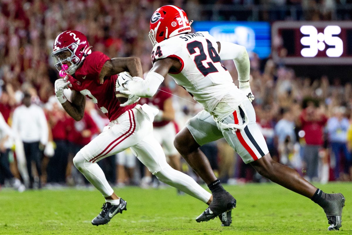 Alabama wide receiver Ryan Williams (#2) runs from a Georgia player. 