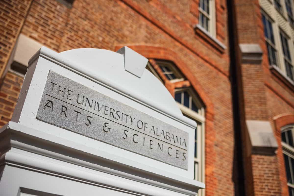 An "Arts & Sciences" sign in front of Presidents Hall.