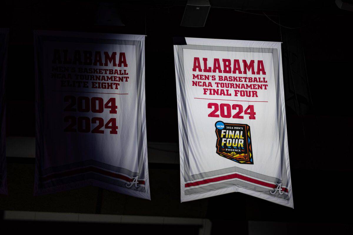 Alabama's Final Four banner is unveiled in the rafters of Coleman Coliseum.