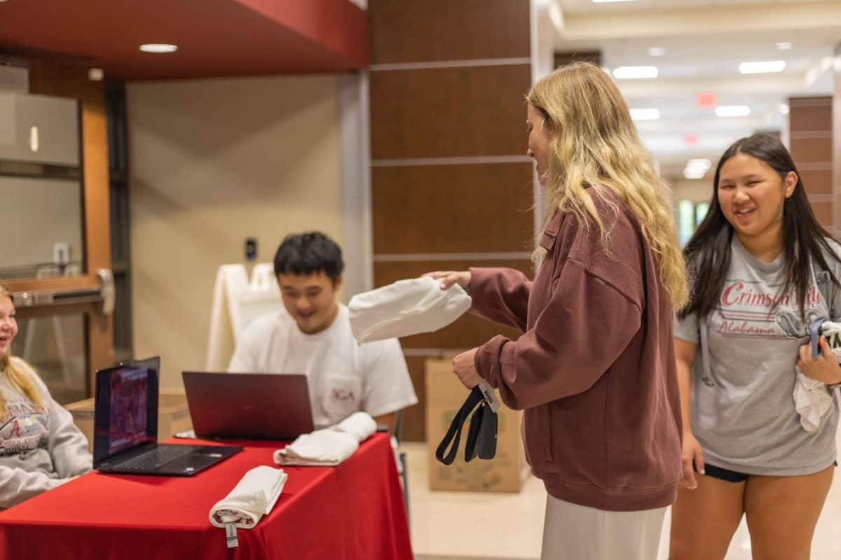 A student grabs a T-shirt.