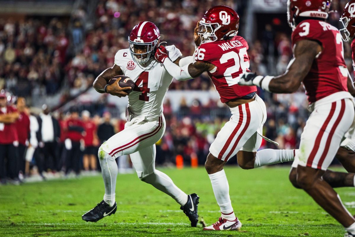 Alabama quarterback Jalen Milroe (#4) runs the ball in Alabama's game against Oklahoma on Nov. 23. 