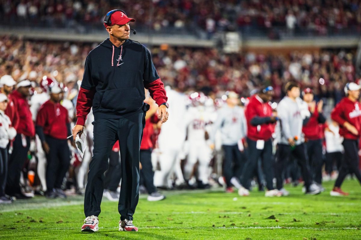 Alabama head coach Kalen DeBoer looks on from the sidelines during a timeout against Oklahoma.