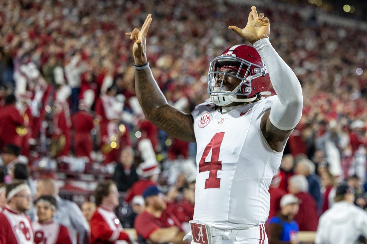 Alabama quarterback Jalen Milroe (#4) signals to the crowd before the game against Oklahoma.