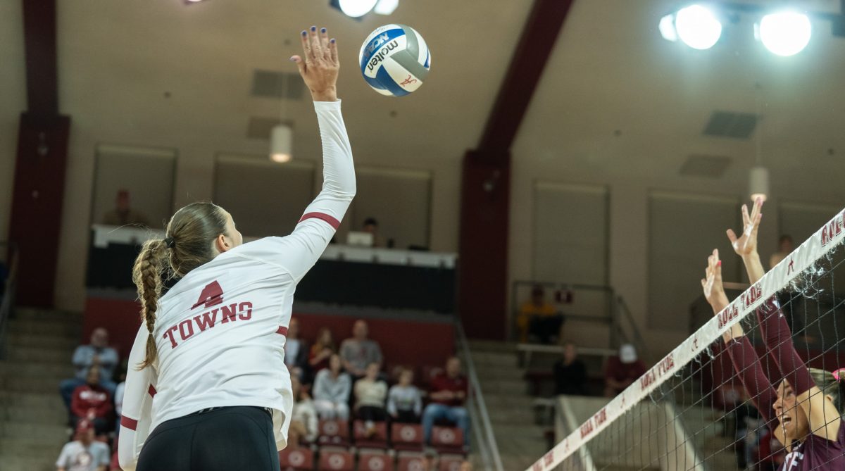 Middle blocker Jordyn Towns hits in Alabama's game against Mississippi State. 