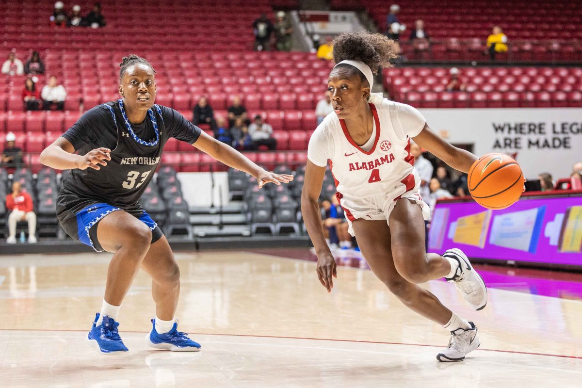 Alabama guard Eris Lester (#4) pushes toward the goal against New Orleans.