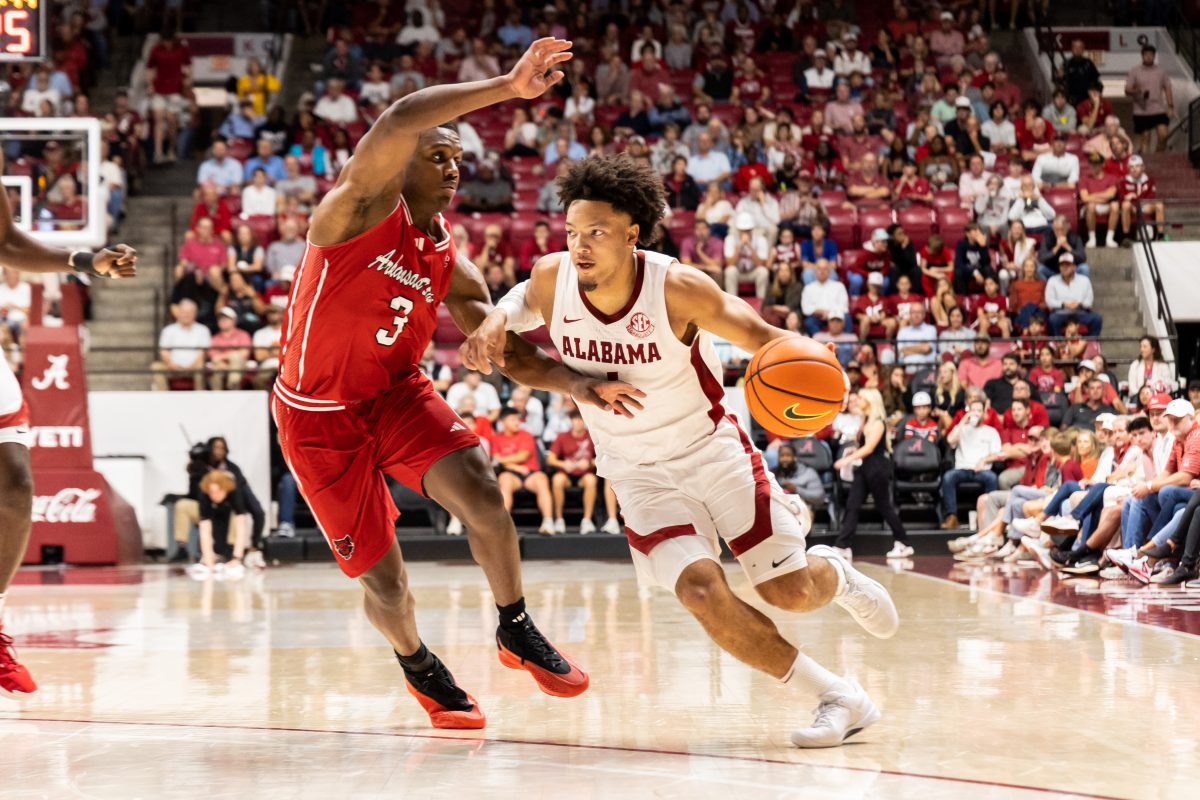 Alabama guard Mark Sears (#1) dribbles past a defender in the Crimson Tide's game against Arkansas State on Nov. 8. 